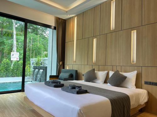 Katil atau katil-katil dalam bilik di Riverla Villa