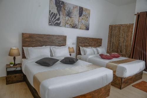 Postel nebo postele na pokoji v ubytování Lucky Transit Hotel - Katunayake Airport