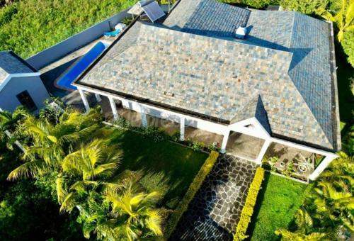 an overhead view of a house with palm trees at N'joy Pereybere Villa in Pereybere