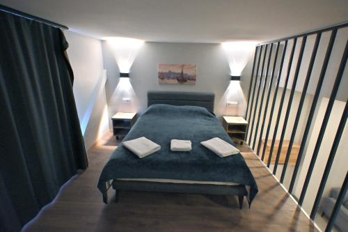 a bedroom with a bed with two pillows on it at Central location LOFT Apartment in Avcılar