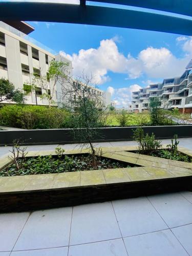 a garden in a courtyard in a building at Dolce vita luxurious apartment in Umhlanga