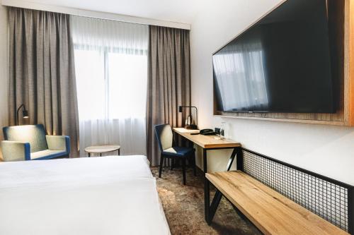 TV a/nebo společenská místnost v ubytování Qubus Hotel Łódź