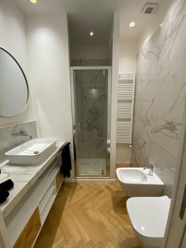 a bathroom with a toilet and a sink and a shower at La Nicchia in Bologna
