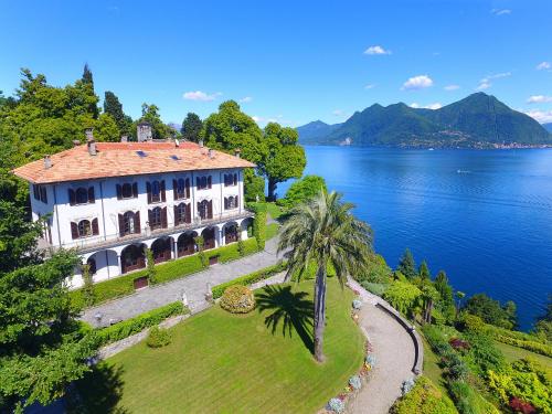 an aerial view of a house on the shore of a lake at Villino San Remigio - Gracious villa with pool & views! in Verbania