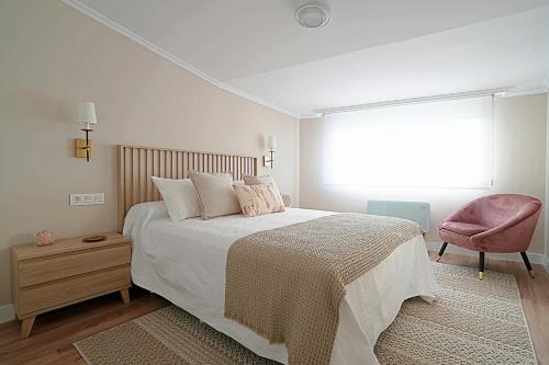 Ένα ή περισσότερα κρεβάτια σε δωμάτιο στο GALIHOST - Apartamentos Raios de Luz