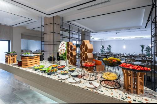 a buffet line with many different types of food at Ewaa Express Hotel - Abha in Abha
