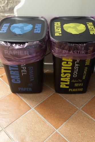 two trash cans sitting next to each other on a floor at BB Diesis in Ferrazzano