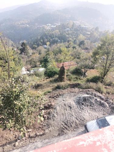 a view of a hill with trees and a road at House First Floor Fully furnished in Dhlkot