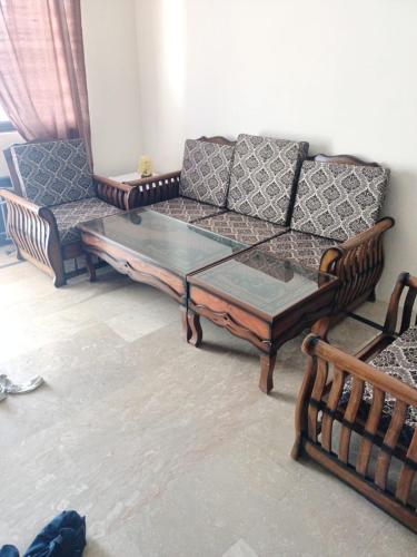 a living room with a couch and a coffee table at House First Floor Fully furnished in Dhlkot