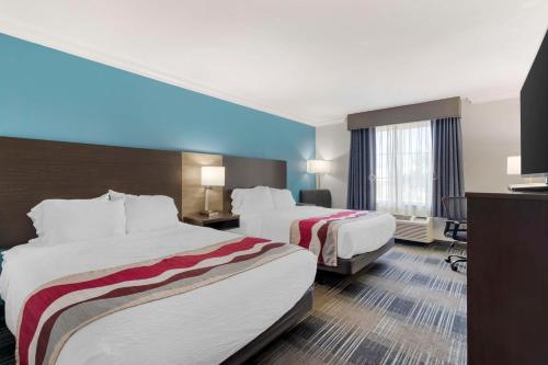 Katil atau katil-katil dalam bilik di Best Western Medical Center North Inn & Suites Near Six Flags