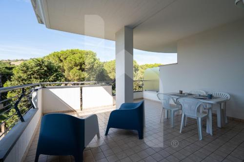 a balcony with a table and chairs and a view at Homiday - Holiday Rendez Vous in Pineto