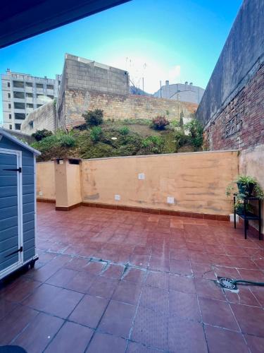 a patio with a wooden fence with plants on it at CarreraHouses Benilde con Garaje in Vigo