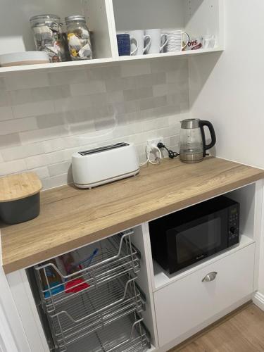 a kitchen with a counter with a microwave on it at Sunny room shared house in Ballarat