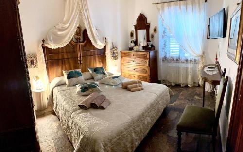 Postel nebo postele na pokoji v ubytování Domo All'Antico Borgo