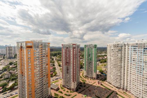 an aerial view of a city with tall buildings at Design Apartments with Panoramic View in Kyiv