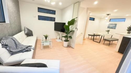 a living room with a white couch and a table at 福吉屋 in Tokyo