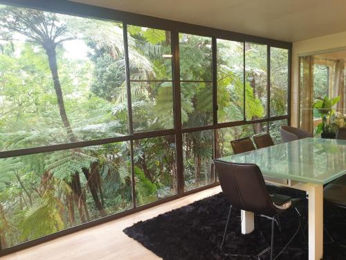 a conference room with a table and a large window at "Forest home,Lake view" in Hornsby