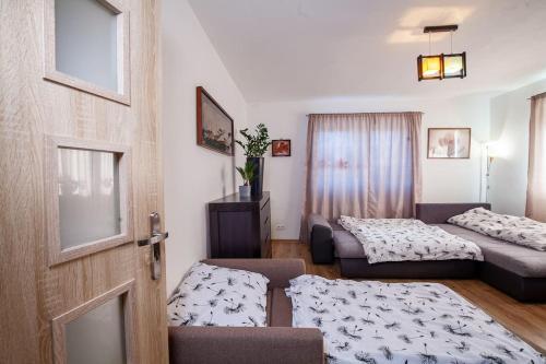 Posteľ alebo postele v izbe v ubytovaní Apartmán ACTIVE