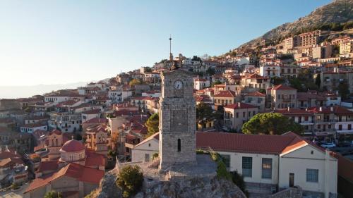 a clock tower in the middle of a city at Maison Michelangelo in Arachova