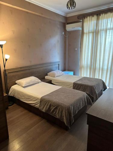 Postel nebo postele na pokoji v ubytování Hotel Nirvana