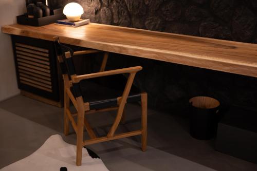 a wooden desk with a chair under it at Maison Michelangelo in Arachova