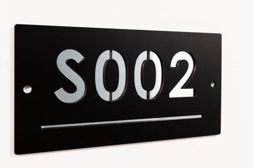 a black sign with at Easylife - FL Suite in Centrale in Milan