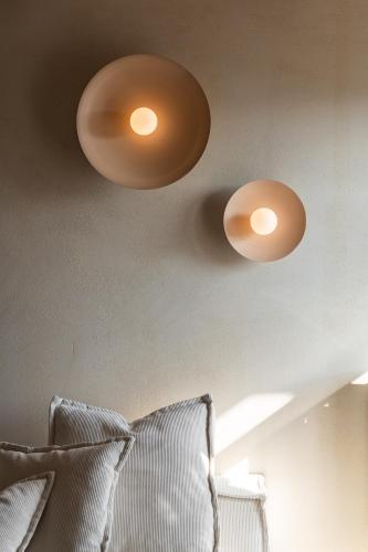 two lights hanging from the ceiling of a room at Maison Michelangelo in Arachova