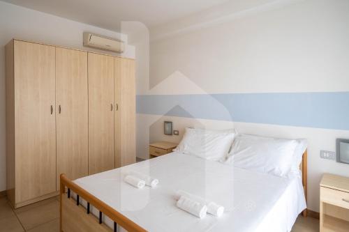Ένα ή περισσότερα κρεβάτια σε δωμάτιο στο Homiday - Holiday Rendez Vous 2