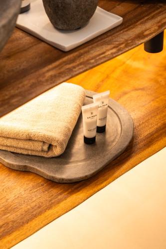 two towels and two cups on a tray on a table at Maison Michelangelo in Arachova