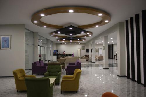 a lobby with chairs and a waiting room at Scylax Hotels Mahmutlar in Alanya