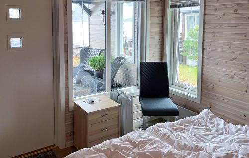 a bedroom with a bed and a desk and a chair at Cozy Home In Treungen in Treungen