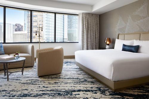 a hotel room with a bed and a large window at InterContinental Seattle Bellevue, by IHG in Bellevue