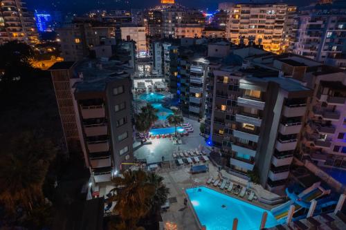 an aerial view of a city at night at Scylax Hotels Mahmutlar in Alanya