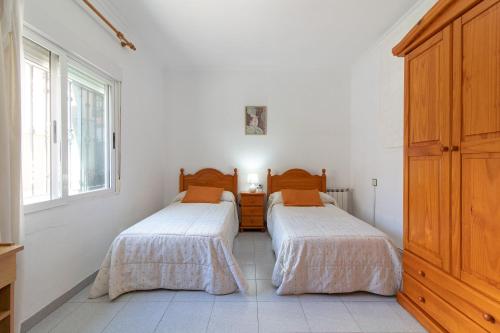 Ένα ή περισσότερα κρεβάτια σε δωμάτιο στο Global Properties, Apartamento en Puerto de Sagunto