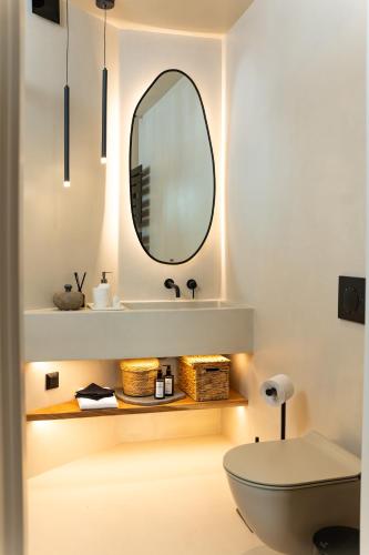 a bathroom with a sink and a mirror at Maison Michelangelo in Arachova