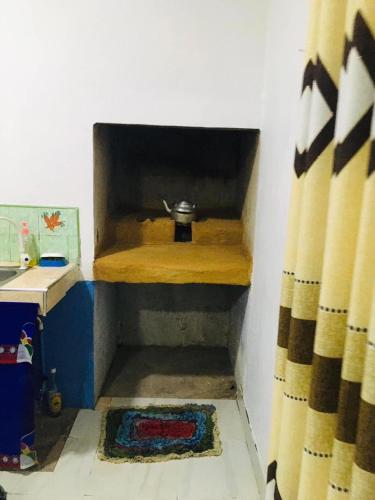 a corner of a room with a shower curtain at Adisham village home in Haputale