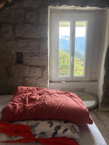 En eller flere senge i et værelse på Haut de maison de village