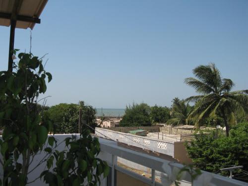 a view from the roof of a building with a palm tree at KEUR MARIE FAYE in Mbour