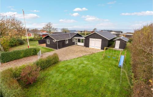 an aerial view of a house with a yard at 4 Bedroom Cozy Home In Vinderup in Vinderup