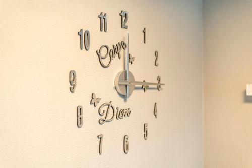 a clock on a wall with the words dance before us at Felsenweg in Lauterbach