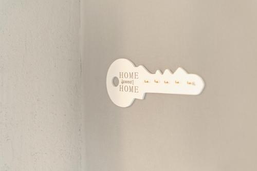 a white remote control hanging on a wall at Felsenweg in Lauterbach