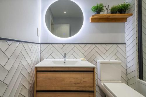 a bathroom with a sink and a mirror at 16 Waterloo Close, Newmarket in Newmarket