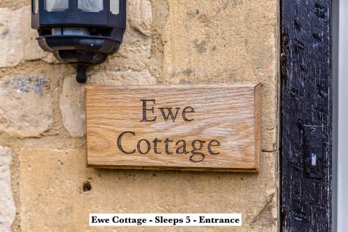 a sign on a wall with the words eye cottage at Mickleton Hills Farm Cotswold Holiday Cottages in Chipping Campden