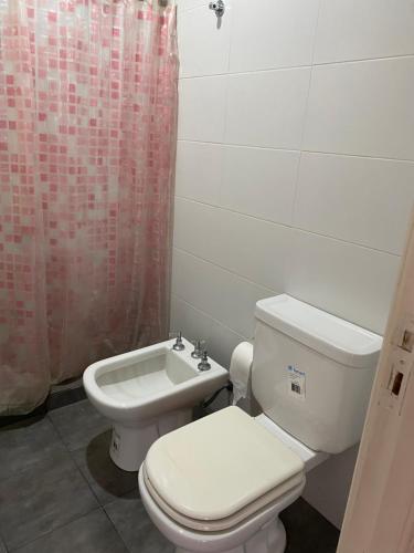 a bathroom with a toilet and a sink at Mar Del Plata Loft in Mar del Plata