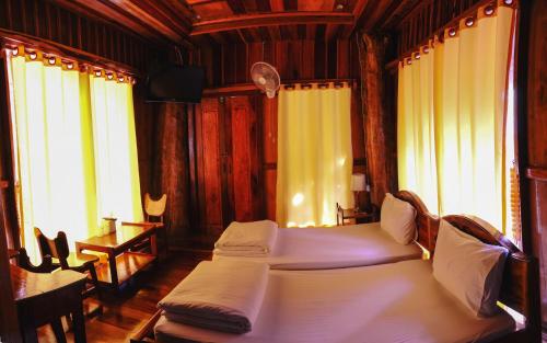 Ліжко або ліжка в номері Daranee Resort