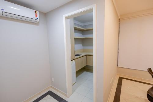 a room with a whiteboard and a chalkboard at Hotel San Gabriel in Sao Paulo