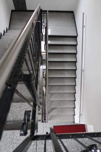 a set of stairs in a building at LUXUS Hostel Rabe in Mühlhausen
