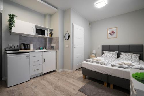 Kuchyň nebo kuchyňský kout v ubytování Wąska 5 Apartamenty