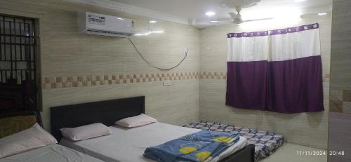 Ένα ή περισσότερα κρεβάτια σε δωμάτιο στο GRACE HOMe