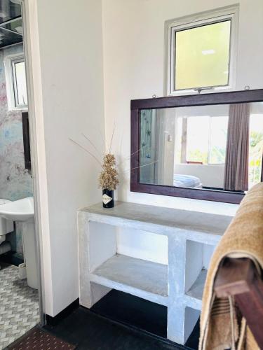a mirror sitting on top of a table in a room at Werala Beach Resort in Kalpitiya